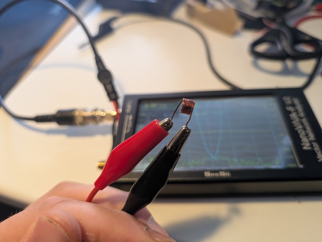 An inductor being tested on the NanoVNA